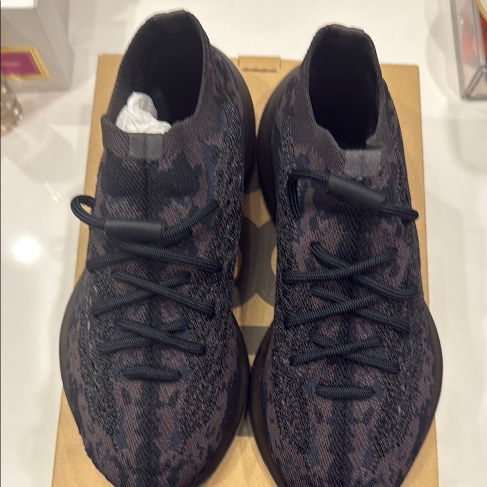 Yeezy Black and Gray Sneakers with Textured Knit Design